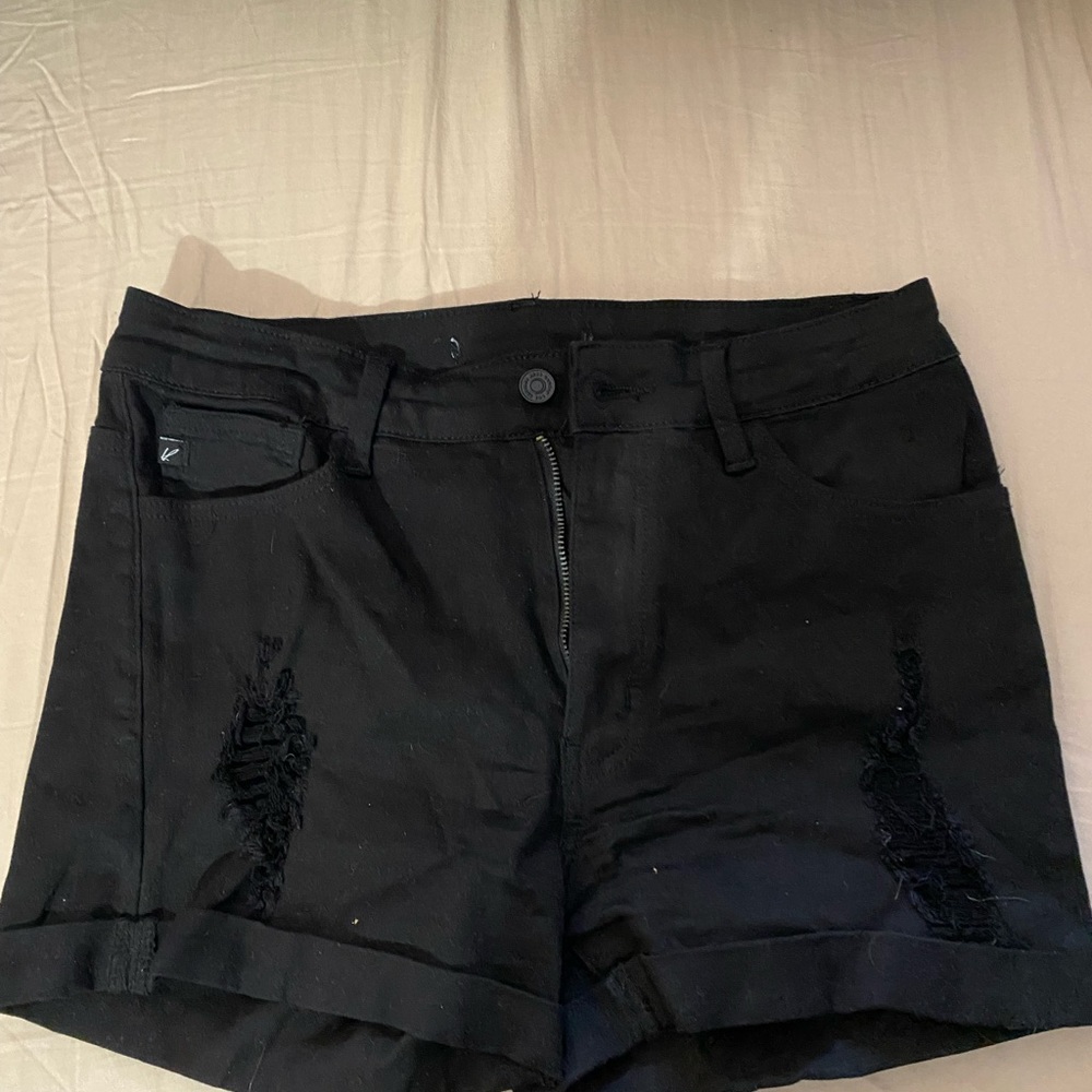 Black distressed Kan Can shorts. Really cute.